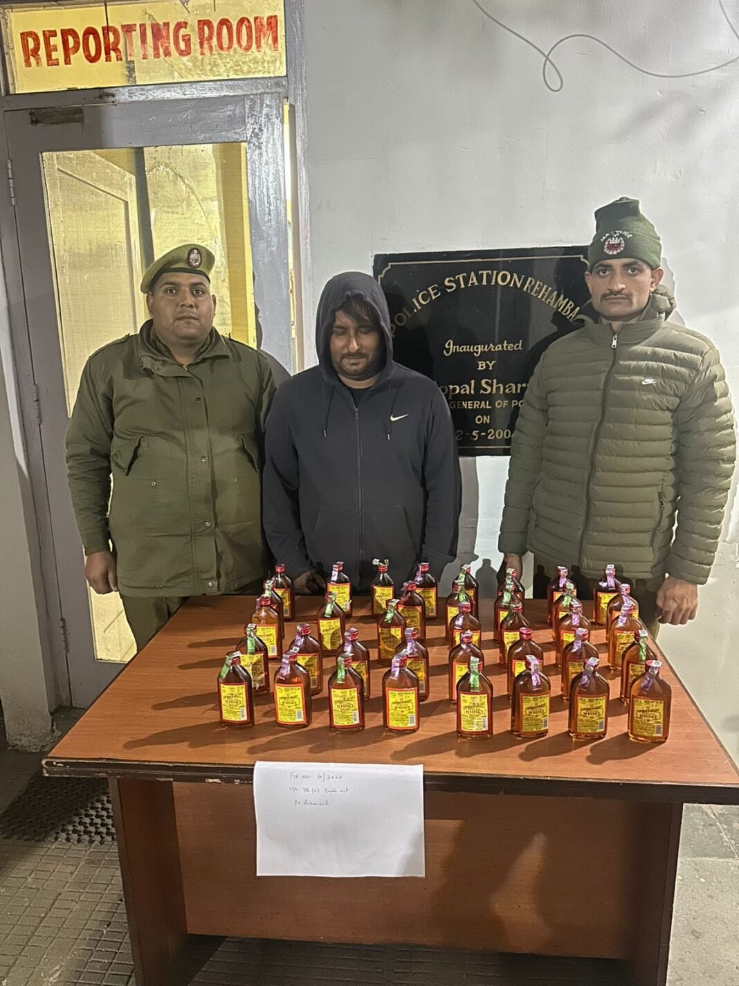ILLICIT LIQUOR SEIZED; BOTTLEGGER ARRESTED