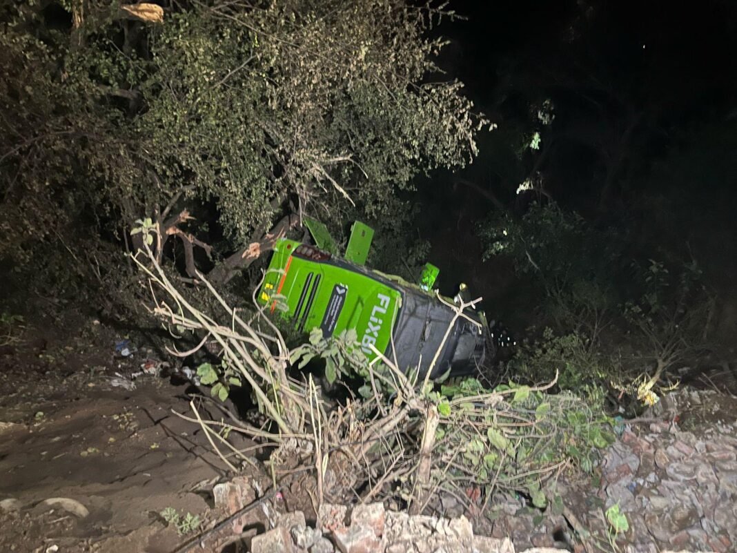DOZENS INJURED AS PILGRIM BUS SKIDS OFF THE ROAD AND FELL INTO DEEP GORGE