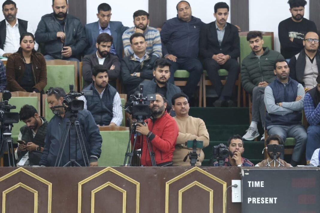 Men on job: Media men busy in press gallery, covering ensuing budget session in Jammu
